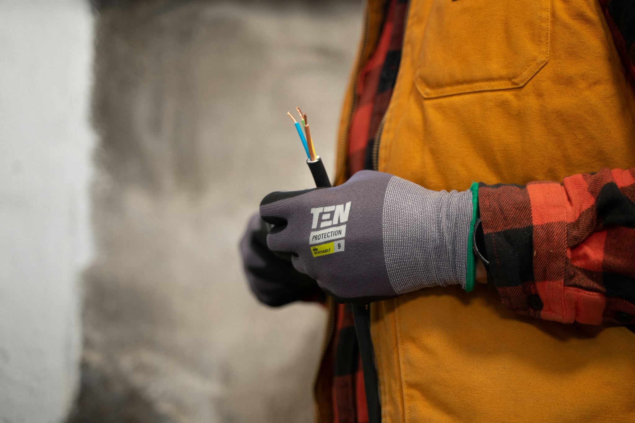 Electrician holding electrical cable